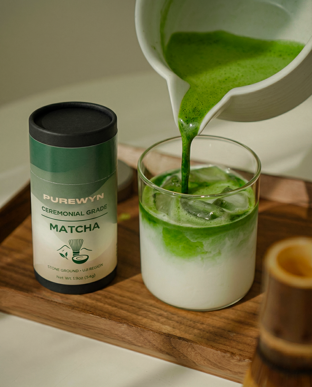 Purewyn ceremonial matcha powder in a bowl with whisk, set on a traditional tea tray for a tea ceremony.