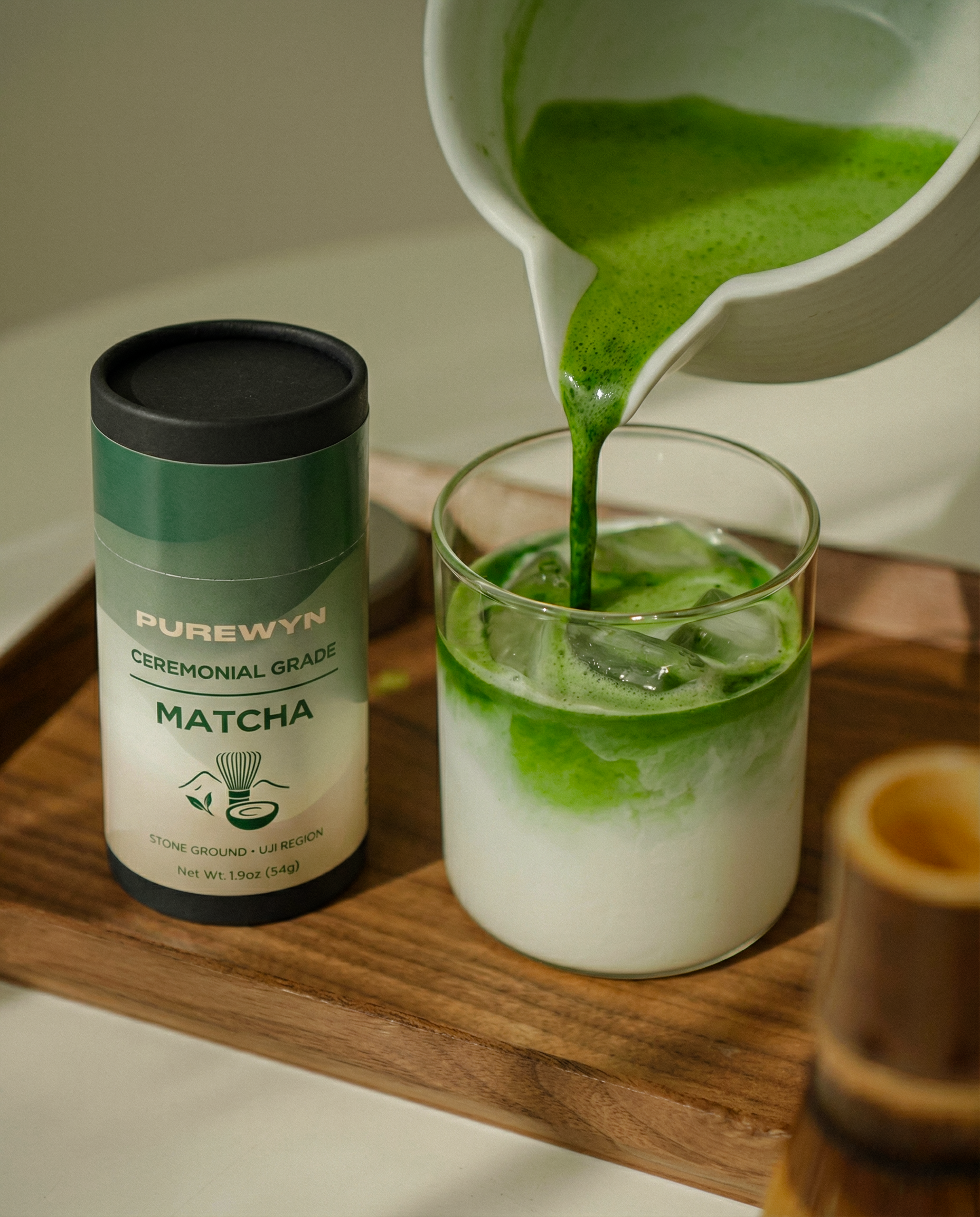 Purewyn ceremonial matcha powder in a bowl with whisk, set on a traditional tea tray for a tea ceremony.